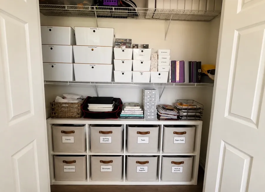 Freshly organized closet with labeled bins